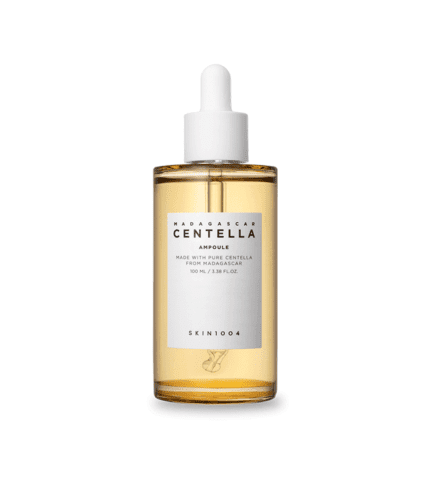 A bottle of SKIN1004 Madagascar Centella Ampoule surrounded by lush greenery.