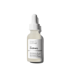 A close-up of THE ORDINARY Alpha Arbutin serum bottle, a skincare product known for its brightening properties.
